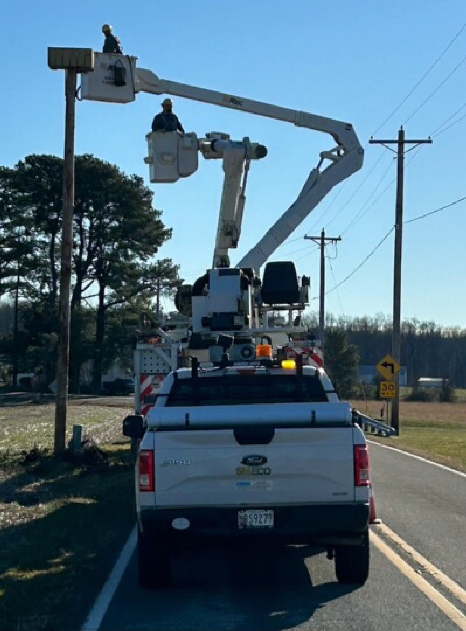 Crews install an osprey platform to protect birds and our equipment.