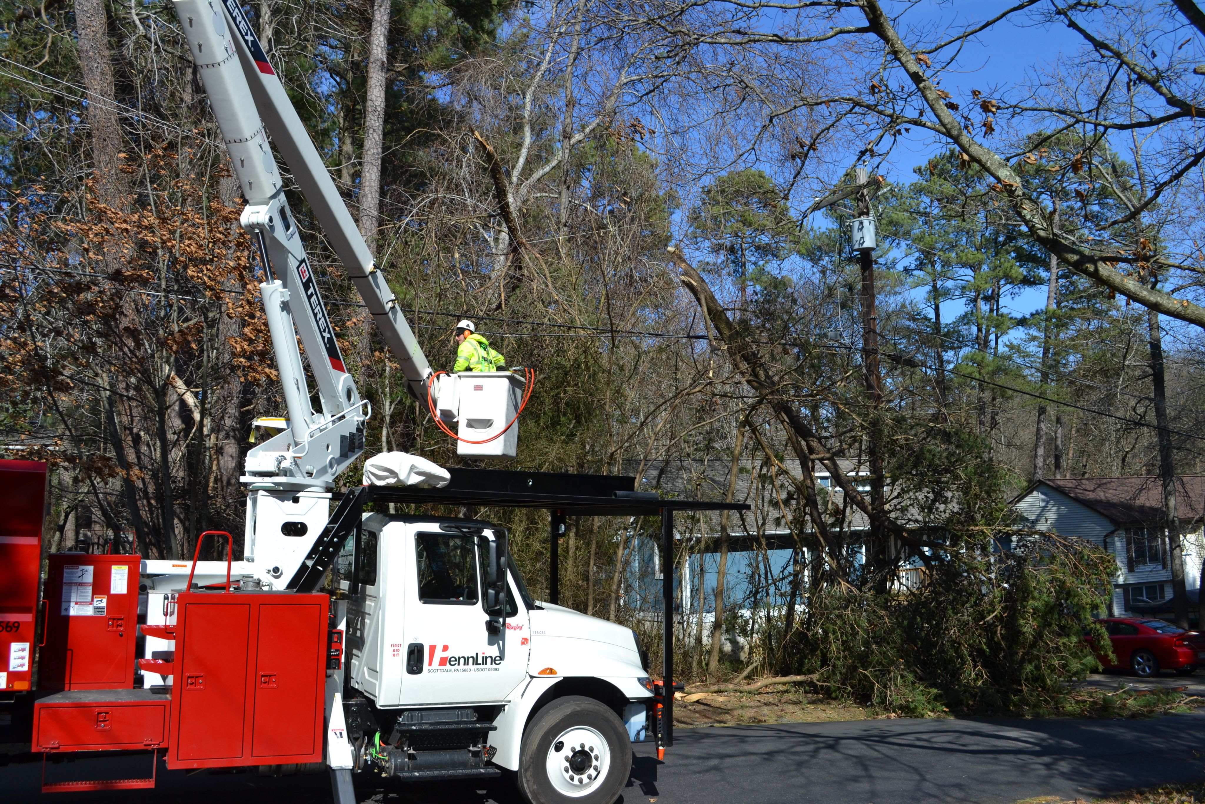 PennLine truck clearing tree limbs