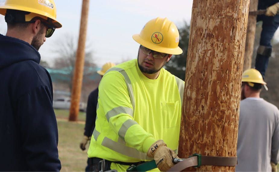 Trying out the line worker life at Apprentice Field Day
